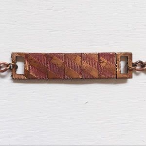 Bronze colored red plaid etched chain bracelet